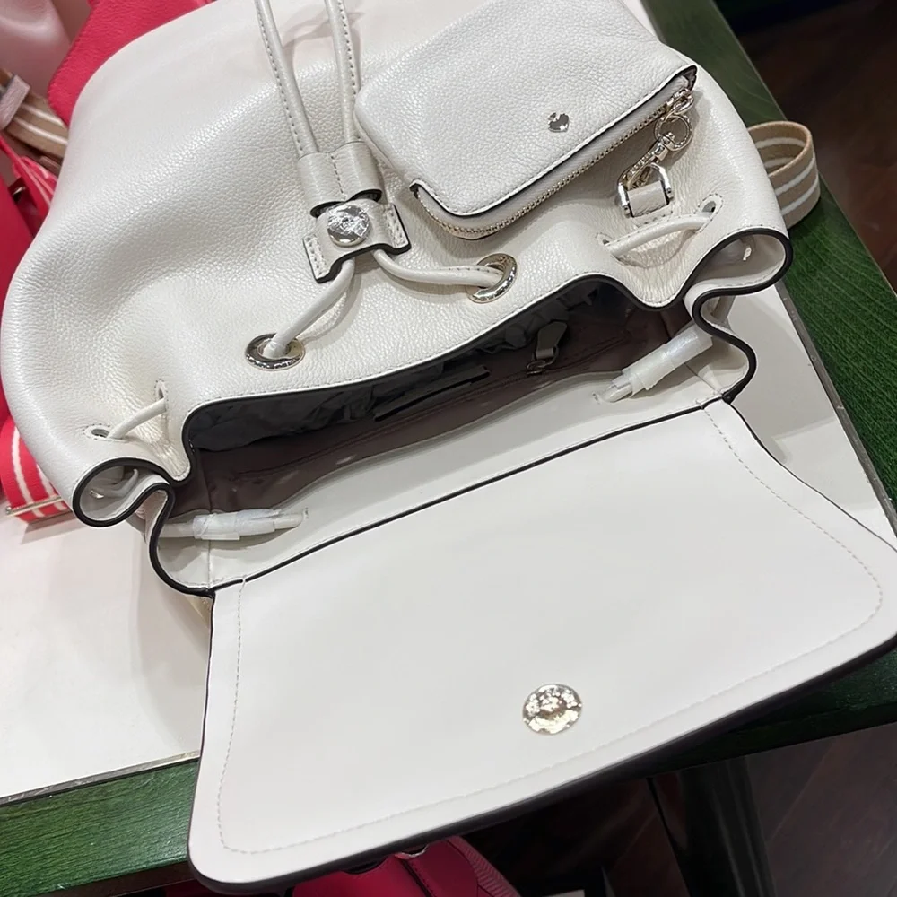 Kate Spade Rosie Medium Flap Backpack 
K8714 pebbled leather Parchment rosie
NWT - Picture 12 of 16